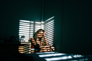 Sad woman dealing with relationship problems after a miscarriage.